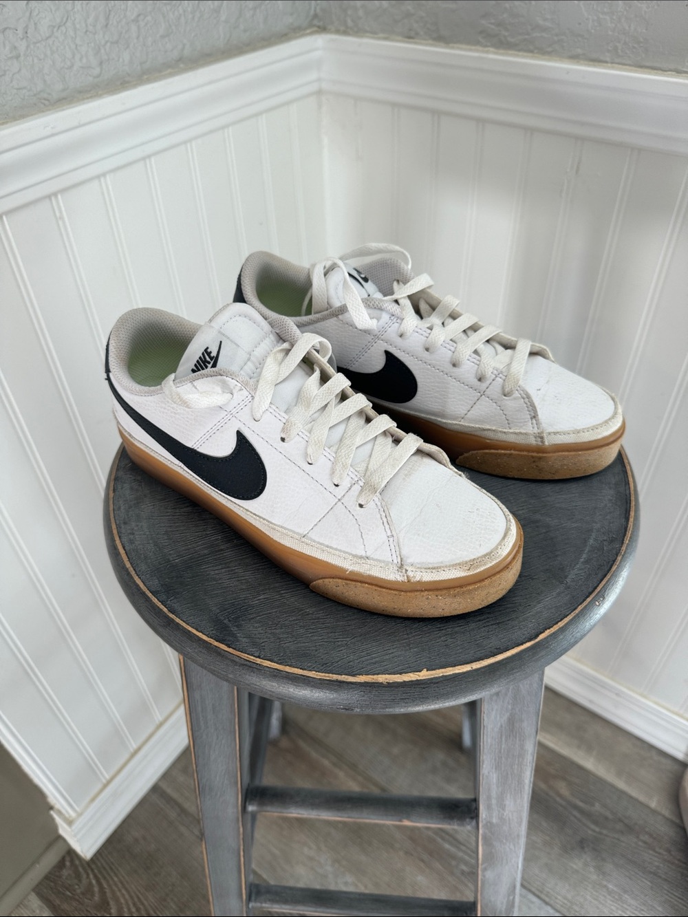 Nike White Low-Top Sneakers with Black Swoosh and Gum Sole